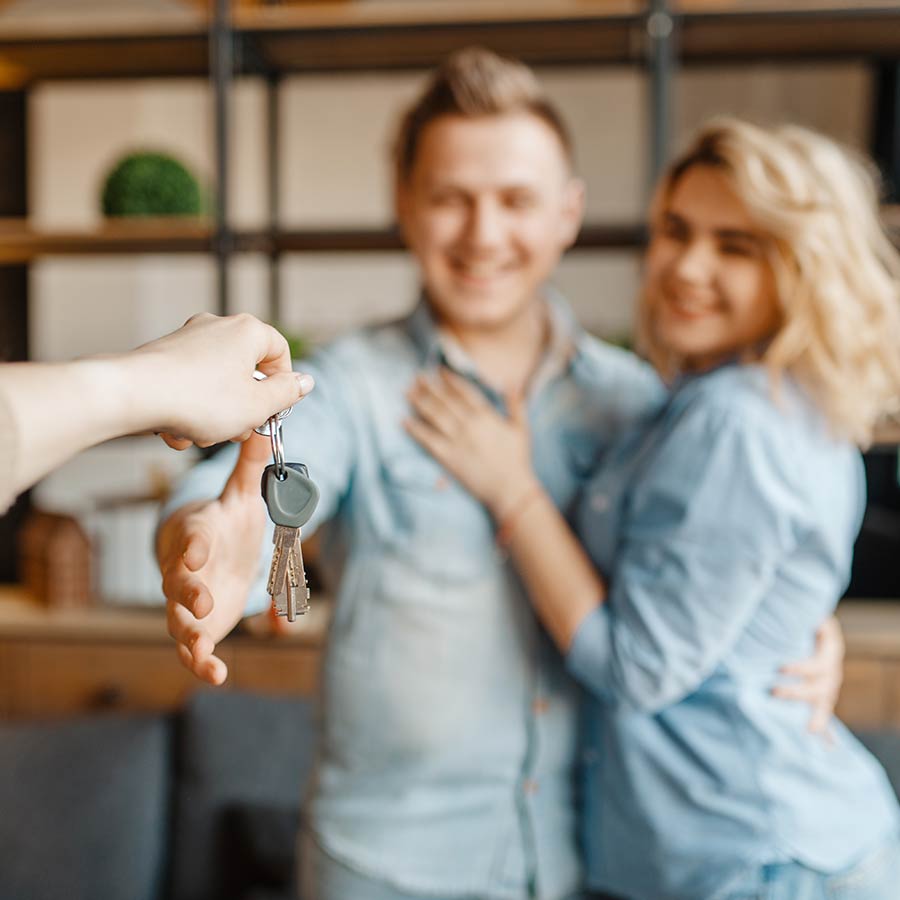 Couple Getting Keys To New Home