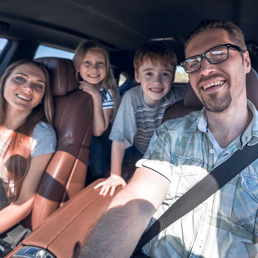 Family In Car Ready To Go