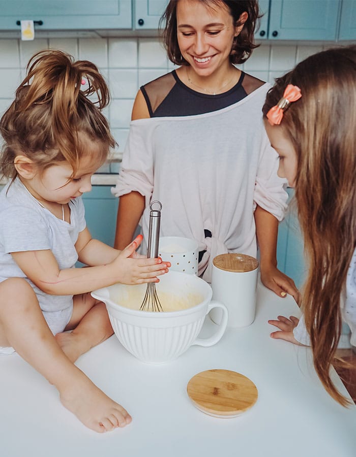Happy Mom Cooking With Daughters In Kitchen Home Loan For Willmar New London Sunburg Vert