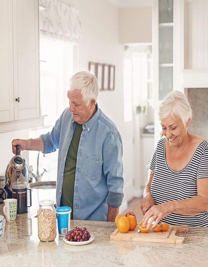 Seniors In Second Home Kitchen Home Loan Process With Lake Region Bank Vert
